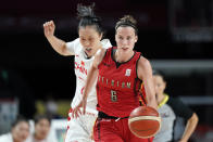 Belgium's Antonia Delaere (6) drives up court ahead of China's Ting Shao (7) during a women's basketball preliminary round game at the 2020 Summer Olympics, Monday, Aug. 2, 2021, in Saitama, Japan. (AP Photo/Charlie Neibergall)