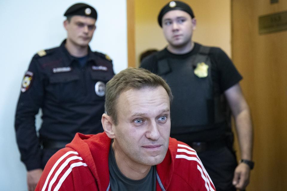FILE- In this file photo taken on Thursday, Aug. 22, 2019, Russian opposition leader Alexei Navalny speaks to the media prior to a court session in Moscow, Russia. The German government says specialist labs in France and Sweden have confirmed Russian opposition leader Alexei Navalny was poisoned with the Soviet-era nerve agent Novichok. (AP Photo/Alexander Zemlianichenko, File)