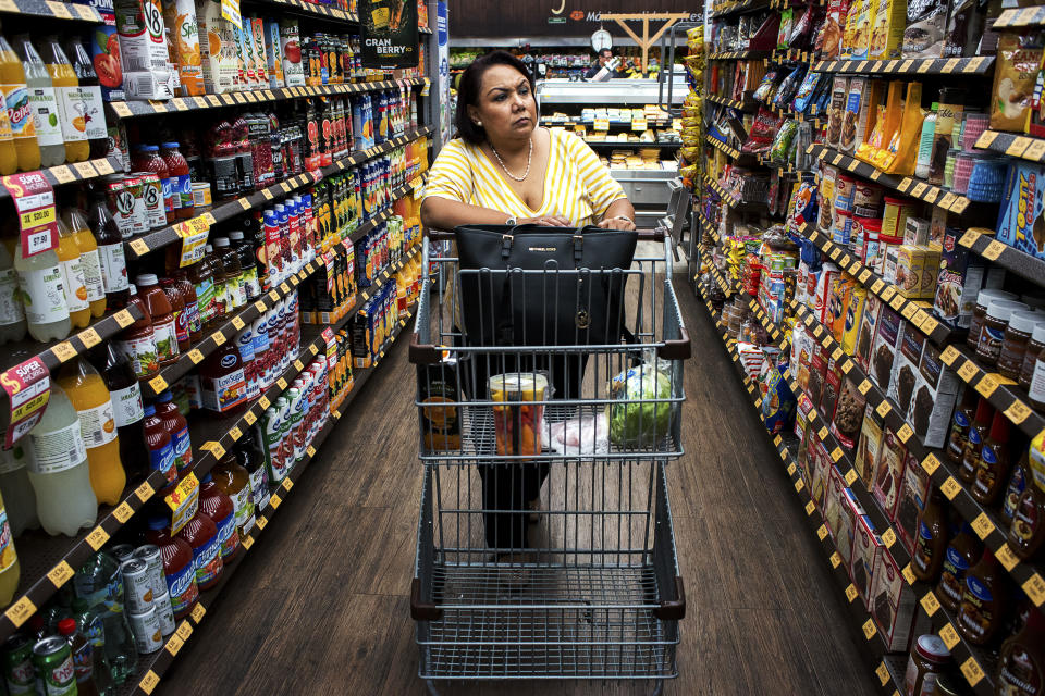 <p>Giosefina Gaytan Caballero, 51, shops in a supermarket. Caballero suffers from rheumatoid arthritis whose symptoms are aggravated by his condition of obesity. “Some would say Mexico’s traditional foods are the cause, but that’s not the case,” said Fabio Da Silva Gomes, regional advisor on nutrition at the Pan American Health Organization (PAHO), a part of the World Health Organization. “If you look at the evidence, what you really see increasing is not an epidemic of traditional soups or beans. No. What is happening is the increase of ultra-processed products and sugary drinks.” (Photograph by Silvia Landi) </p>