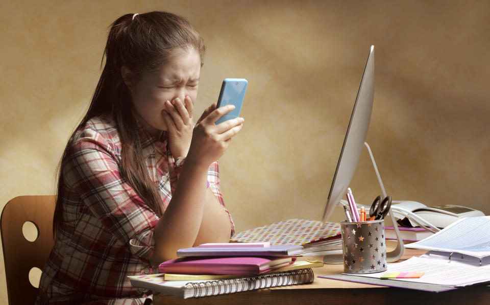 A girl recording herself while crying