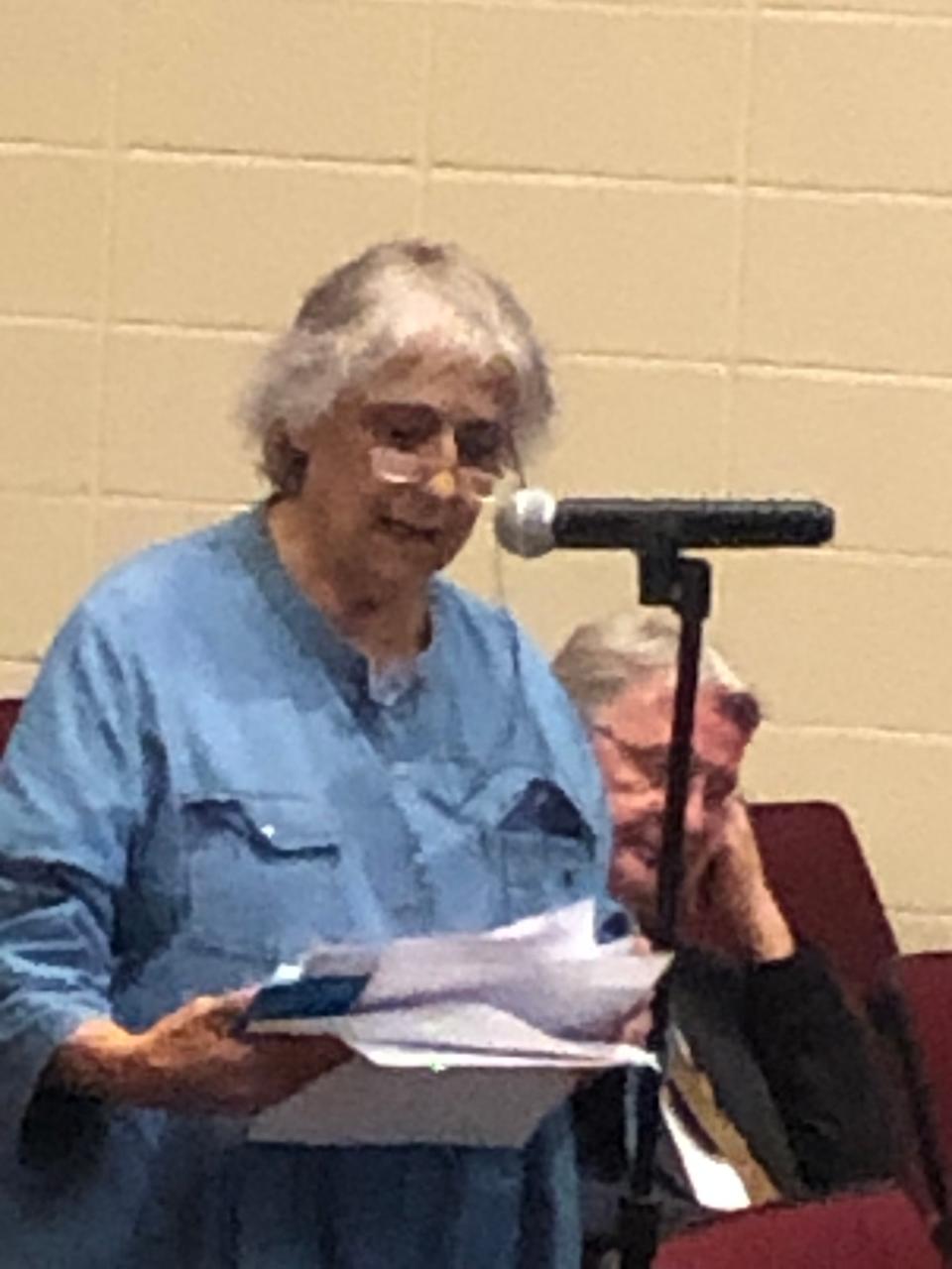 Swansea resident Geri Mullaly speaks Wednesday night at Swansea's Municipal Complex Project information session held at the Joseph Case High School auditorium.