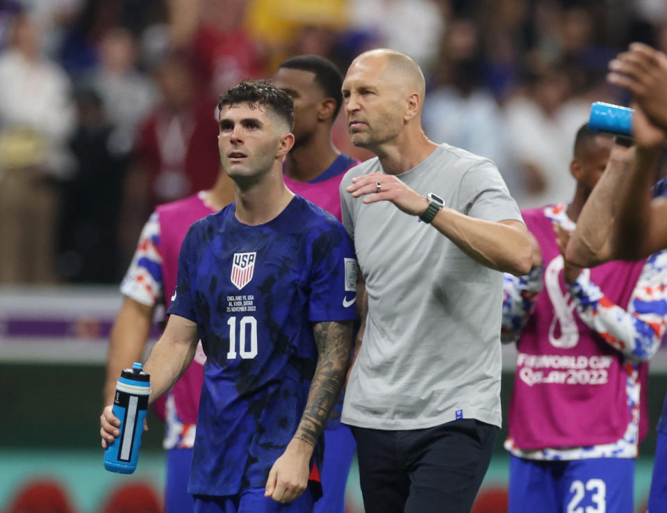 Soccer Football - FIFA World Cup Qatar 2022 - Group B - England v United States - Al Bayt Stadium, Al Khor, Qatar - November 25, 2022 U.S. coach Gregg Berhalter with Christian Pulisic after the match REUTERS/Paul Childs