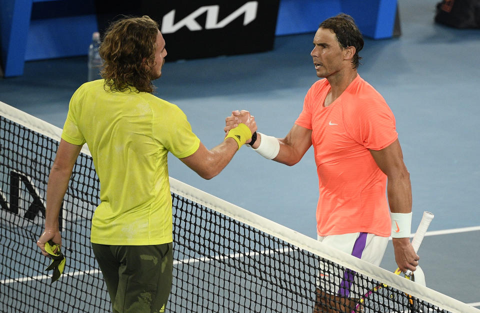 Greece's Stefanos Tsitsipas, left, is congratulated by Spain's Rafael Nadal after winning their quarterfinal match at the Australian Open tennis championship in Melbourne, Australia, Wednesday, Feb. 17, 2021.(AP Photo/Andy Brownbill)