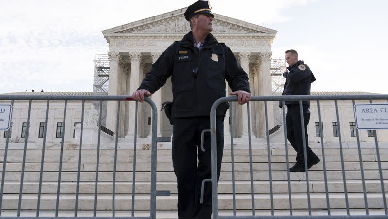 Police put a fence outside of the U.S. Supreme Court on Thursday, Feb. 8, 2024, in Washington. The U.S. Supreme Court took oral arguments on a historic case that could decide whether Donald Trump is ineligible for the 2024 ballot under Section 3 of the 14th Amendment.
