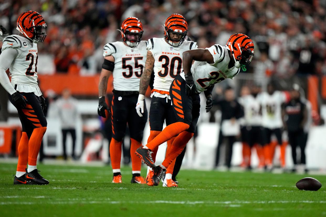 Bengals cornerback Chidobe Awuzie limps off the field in Cleveland.