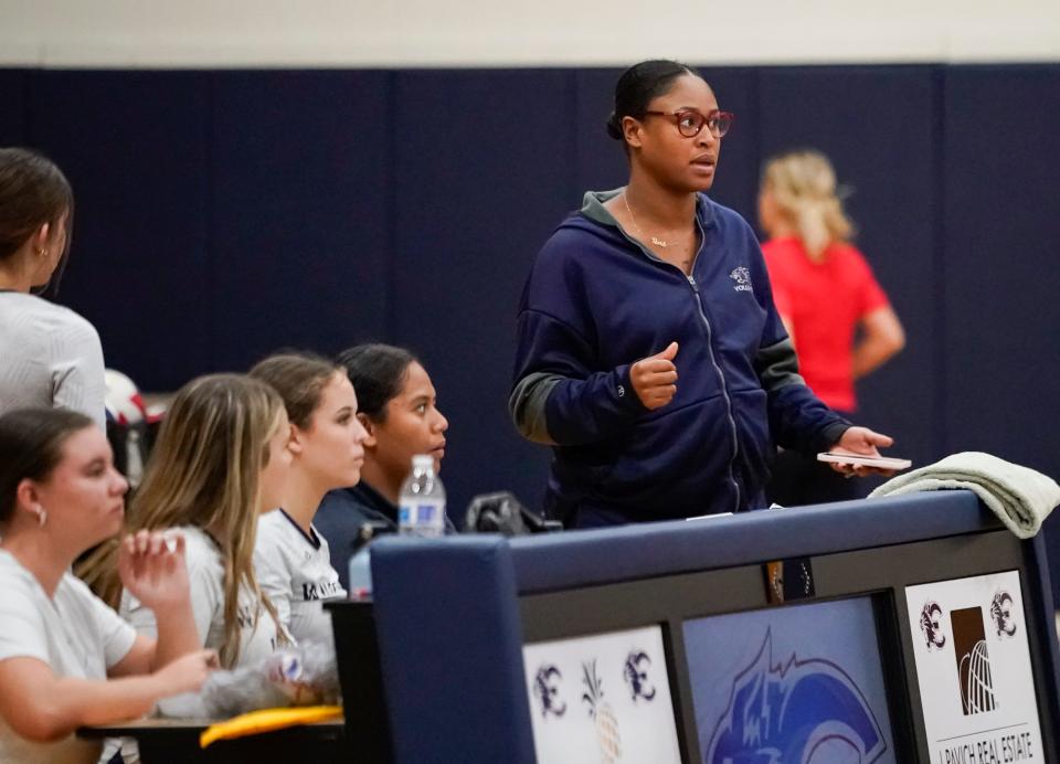 Estero Wildcats assistant coach Taylor Reid watches as the team competes against the Riverdale Raiders at Estero High School on Tuesday, Oct. 3, 2023.