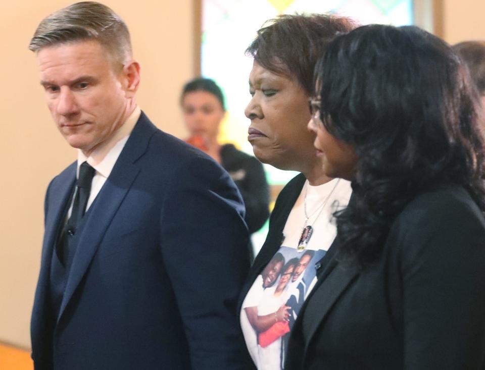 Attorney Bobby DiCello accompanies Pamela Walker, left, mother of Jayland Walker, and U.S. Rep. Emilia Sykes as they enter a press conference Monday at St. Ashworth Temple Church of God in Christ in Akron.