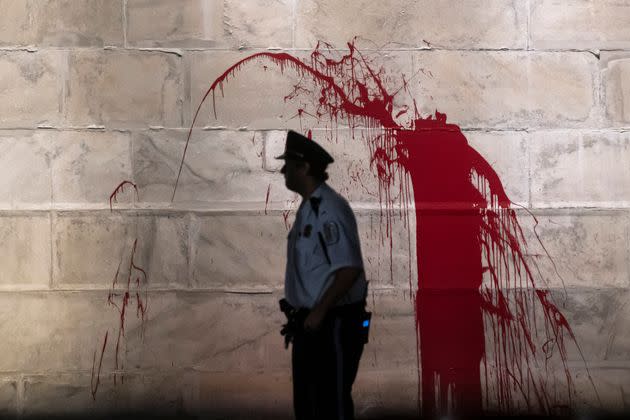 A splash of blood-red paint on the Washington Monument (Photo: Nathan Howard via Getty Images)