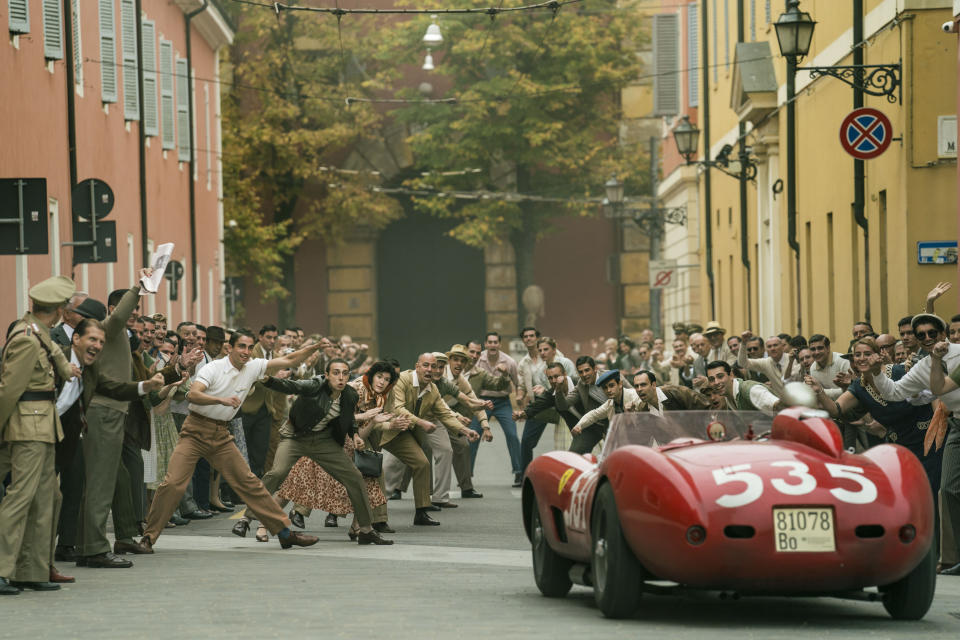 Huge crowds of racing fans gather in an Italian city to watch the Mille Miglia race in Michael Mann's "Ferrari." As a safety precaution, Mann made sure that everyone pictured in the path of the cars was a professional stunt person. (Eros Hoagland)