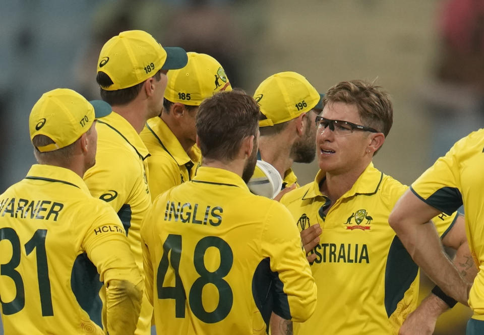 Australia's Adam Zampa talks to his teammates during the ICC Men's Cricket World Cup match between Australia and Sri Lanka in Lucknow, India, Monday, Oct. 16, 2023. (AP Photo/Aijaz Rahi)