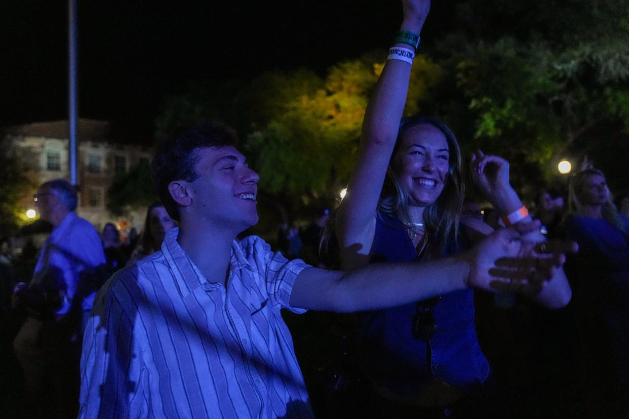 Logan Dubel and Coco Kennedy, sophomores at UT, enjoy Jordan Davis and NEEDTOBREATHE's performance at the UT Tower on April 5, 2024.