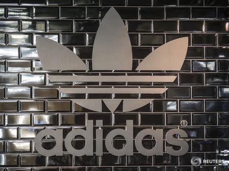 The Adidas logo is pictured in a pop-up store in Berlin December 2, 2014. REUTERS/Hannibal Hanschke