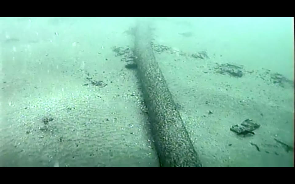 FILE - This still image from video taken Oct. 4, 2021, and provided by the U.S. Coast Guard shows an underwater pipeline that spilled tens of thousands of gallons of oil off the coast of Orange County, Calif. A Houston-based oil company on Monday, Feb. 28, sued two container ship operators and an organization that helps oversee marine traffic, saying they failed to prevent last fall's underwater pipeline leak off the Southern California coast. Amplify Energy Corp., which owns the pipeline that ruptured and faces a criminal charge for its oversight, claims that in January 2021 two ships dragged their anchors across the pipeline that ferried crude from offshore oil platforms to the coast. (U.S. Coast Guard via AP, File)
