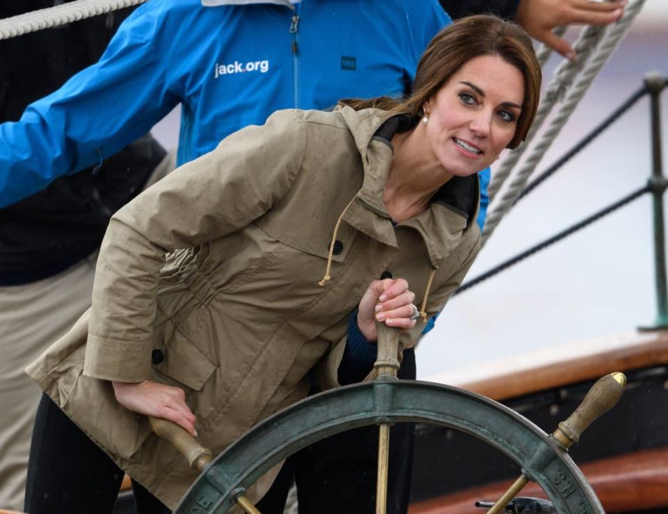 The Duchess of Cambridge tries her hand at steering the Pacific Grace tall ship with members of the Sail and Life Training society before docking at Ship Point at the inner harbour in Victoria, B.C., Saturday, October 1, 2016. THE CANADIAN PRESS/Chad Hipolito