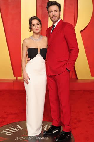 <p>Amy Sussman/Getty </p> Alba Baptista and Chris Evans attend the 2024 Vanity Fair Oscar Party