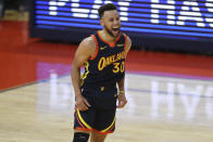 Golden State Warriors guard Stephen Curry yells after making a 3-point shot against Houston Rockets during the second half of an NBA basketball game in San Francisco, Saturday, April 10, 2021. (AP Photo/Jed Jacobsohn)