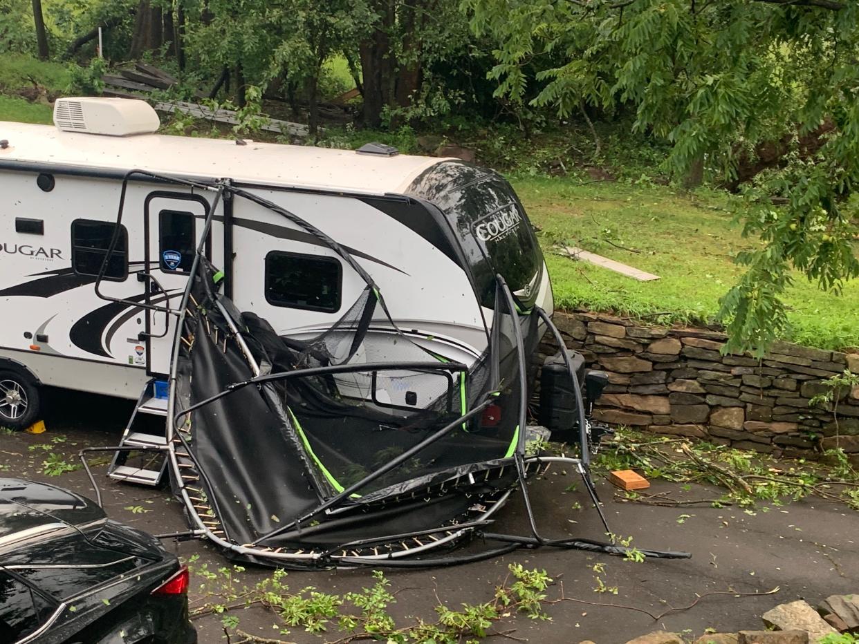 A trampoline lays next to an RV in the driveway of a home in Plumstead on Thursday, July 29, 2021.