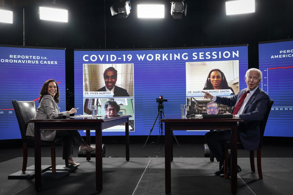 WILMINGTON, DE - AUGUST 13: Democratic presidential candidate former Vice President Joe Biden (R) and his running mate Sen. Kamala Harris (D-CA) acknowledge the press as they attend a coronavirus briefing at a makeshift studio at the Hotel DuPont on August 13, 2020 in Wilmington, Delaware. Harris is the first woman of color in U.S. history to be named to the top of a major party presidential ticket. (Photo by Drew Angerer/Getty Images) 