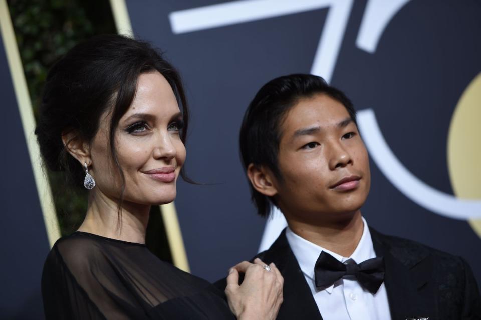 Angelina Jolie and her son Pax arrive for the 75th Golden Globe Awards on January 7, 2018, in Beverly Hills, California (AFP via Getty Images)