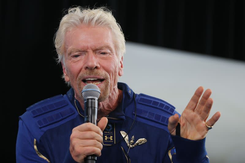 FILE PHOTO: Billionaire entrepreneur Richard Branson wears his astronaut's wings at a news conference at Spaceport America