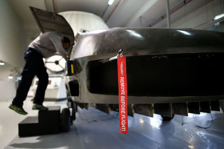 A worker works on a prototype of the Cormorant, a drone, at Urban Aeronautics' workshop in Yavne, Israel December 22, 2016. REUTERS/Amir Cohen