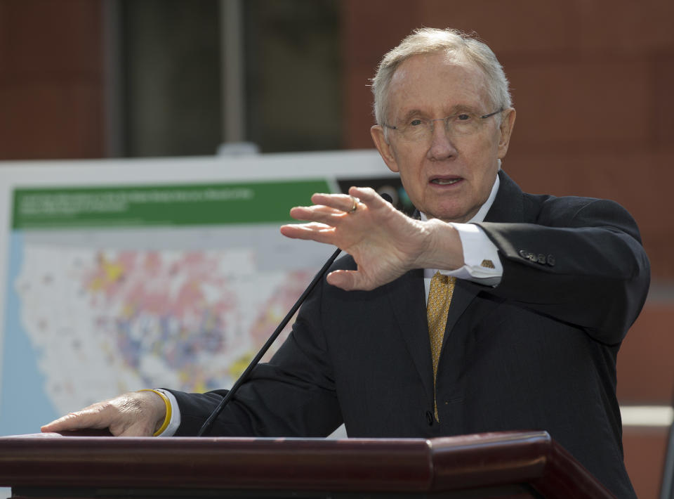 Senate Majority Leader Harry Reid, speaks at a news conference, Friday, Oct. 12, 2012, in Las Vegas, in which he and Interior Secretary Ken Salazar announced a plan that sets aside 285,000 acres of public land for the development of large-scale solar power plants. The government is establishing 17 new "solar energy zones" on 285,000 acres in six states: California, Nevada, Arizona, Utah, Colorado and New Mexico. Most of the land,153,627 acres, is in Southern California. (AP Photo/Julie Jacobson)