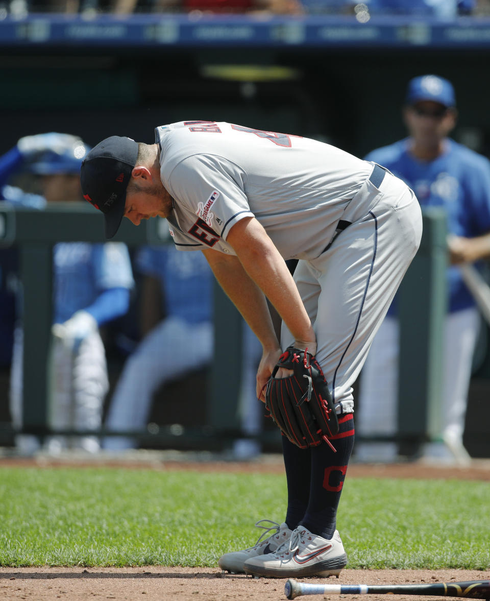 Cleveland Indians pitcher Trevor Bauer reacts near home plate after the Kansas City Royals scored a run in the fifth inning of a baseball game at Kauffman Stadium in Kansas City, Mo., Sunday, July 28, 2019. (AP Photo/Colin E. Braley)