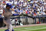 Chicago Cubs' Dansby Swanson hits a double during the second inning of a baseball game against the Milwaukee Brewers Monday, July 3, 2023, in Milwaukee. (AP Photo/Morry Gash)