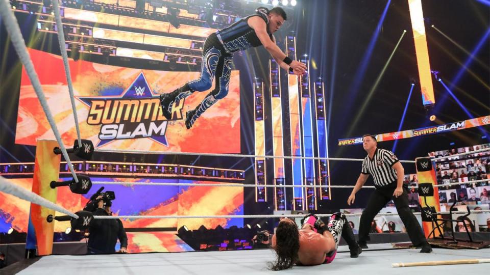Dominik Mysterio using his signature frog splash during his match against Seth Rollins at SummerSlam. (Photo credit: WWE)