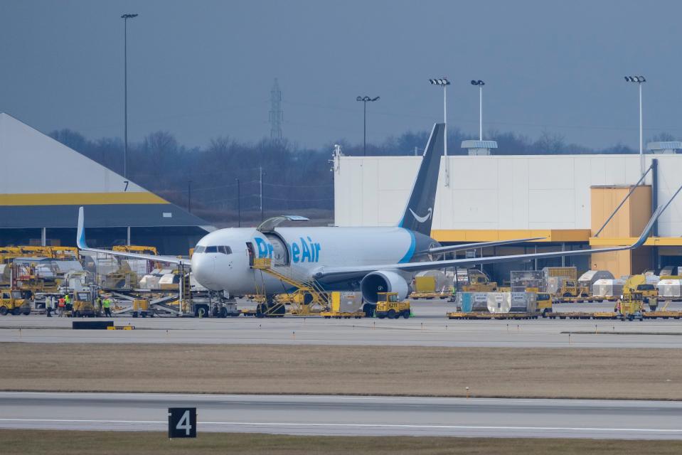 An Amazon Air jet is loaded at Cincinnati/Northern Kentucky International Airport in Hebron, Ky., on Wednesday, Jan. 11, 2023.