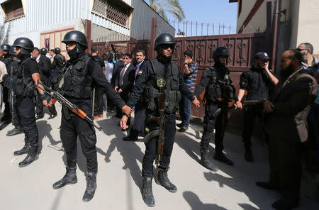 Members of security forces loyal to Hamas stand guard during a visit by Palestinian Prime Minister Rami Hamdallah in Gaza City October 2, 2017. REUTERS/Ibraheem Abu Mustafa