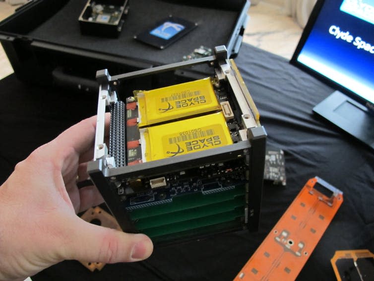 <span class="caption">CubeSat in hand.</span> <span class="attribution"><span class="source">wikipedia</span>, <a class="link " href="http://creativecommons.org/licenses/by-sa/4.0/" rel="nofollow noopener" target="_blank" data-ylk="slk:CC BY-SA;elm:context_link;itc:0;sec:content-canvas">CC BY-SA</a></span>