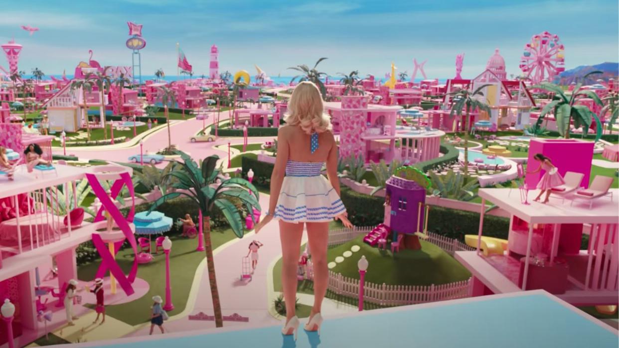  Backshot of Barbie overlooking Barbie world from her dream house 