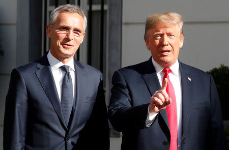 U.S. President Donald Trump is greeted by NATO Secretary General Jens Stoltenberg before a bilateral breakfast ahead of the NATO Summit in Brussels, Belgium July 11, 2018. REUTERS/Kevin Lamarque