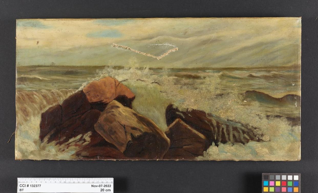 Edith England's 1890s oil painting Waves Over Rocks took on a yellow-grey tone due to surface layers of aged, darkened varnish and grime. (Canadian Conservation Institute/Facebook - image credit)