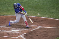 Toronto Blue Jays' Vladimir Guerrero Jr. connects for a solo home run off Baltimore Orioles starting pitcher Dean Kremer during the third inning of the first game of a baseball doubleheader, Saturday, Sept. 11, 2021, in Baltimore. (AP Photo/Julio Cortez)