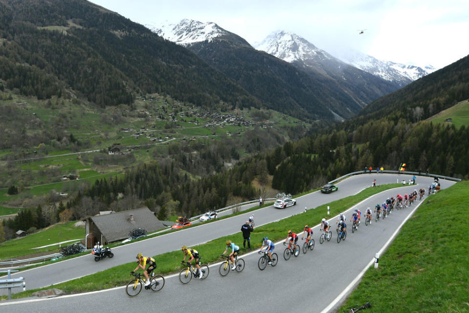 Rohan Dennis tucked in third wheel behind his teammates on the mountainous stage 4 of the Tour de Romandie in 2022
