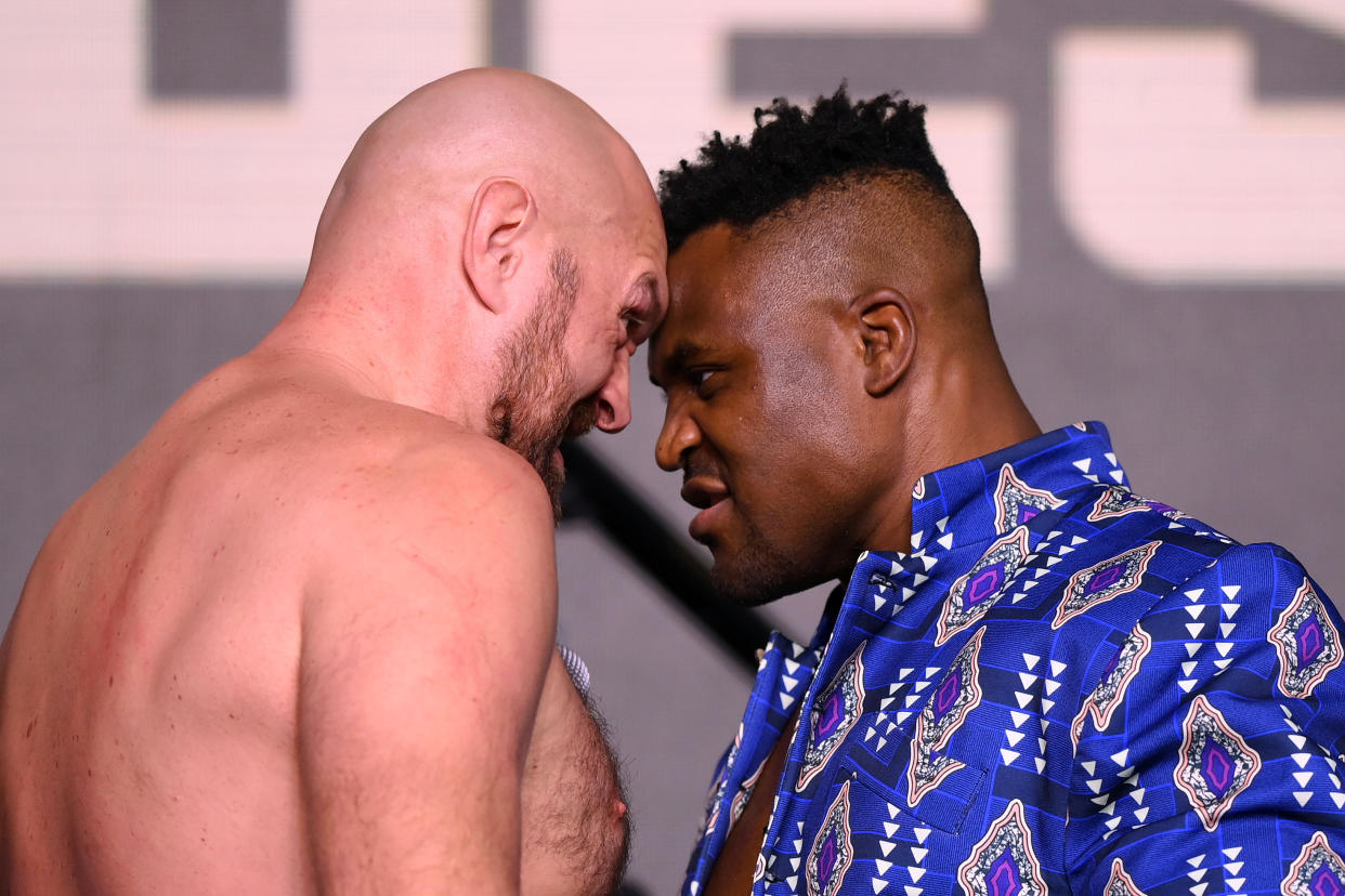RIYADH, SAUDI ARABIA - OCTOBER 26: Tyson Fury and Francis Ngannou face off during a press conference ahead of the Tyson Fury v Francis Ngannou boxing match at Boulevard Hall on October 26, 2023 in Riyadh, Saudi Arabia. (Photo by Justin Setterfield/Getty Images)