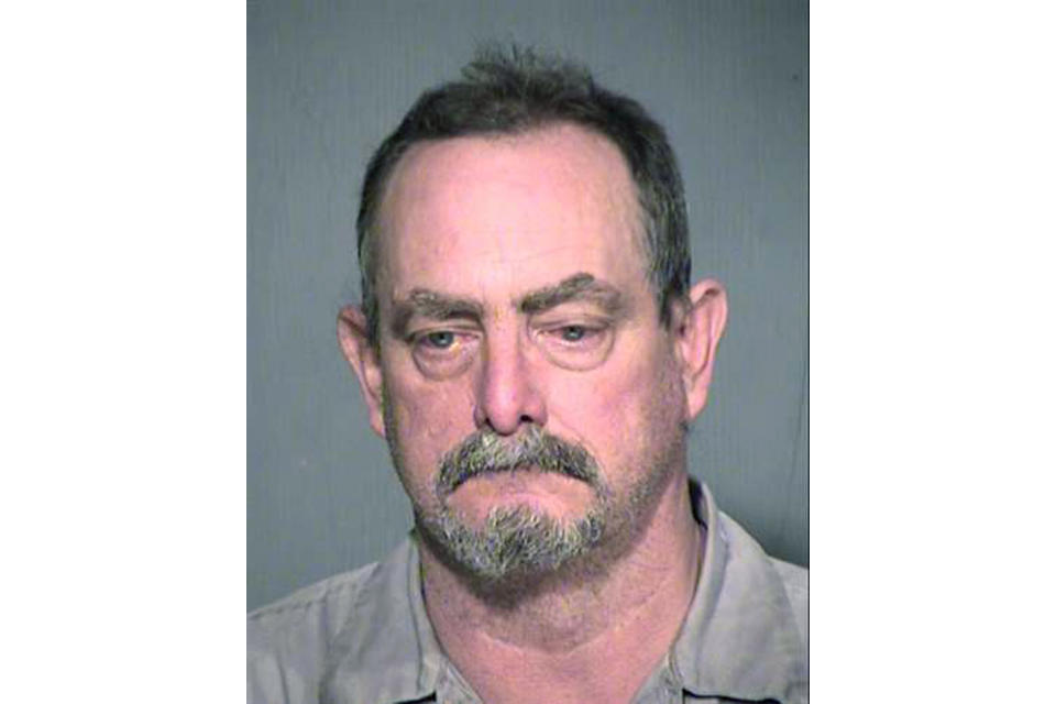 This undated photo released by the Maricopa County Sheriff's Office shows Daniel Davitt. Authorities say Davitt, a Phoenix area jail officer who was comatose after being attacked by an inmate, has died. Maricopa County Sheriff Paul Penzone said 59-year-old Daniel Davitt attacked Officer Gene Lee without provocation Tuesday, Oct. 29, 2019. He said Lee was grabbed by the throat from behind and knocked to the ground. Penzone said Lee's head hit the cement floor and he never regained consciousness. Davitt faces sex crime charges involving children and is representing himself. (Maricopa County Sheriff's Office via AP)