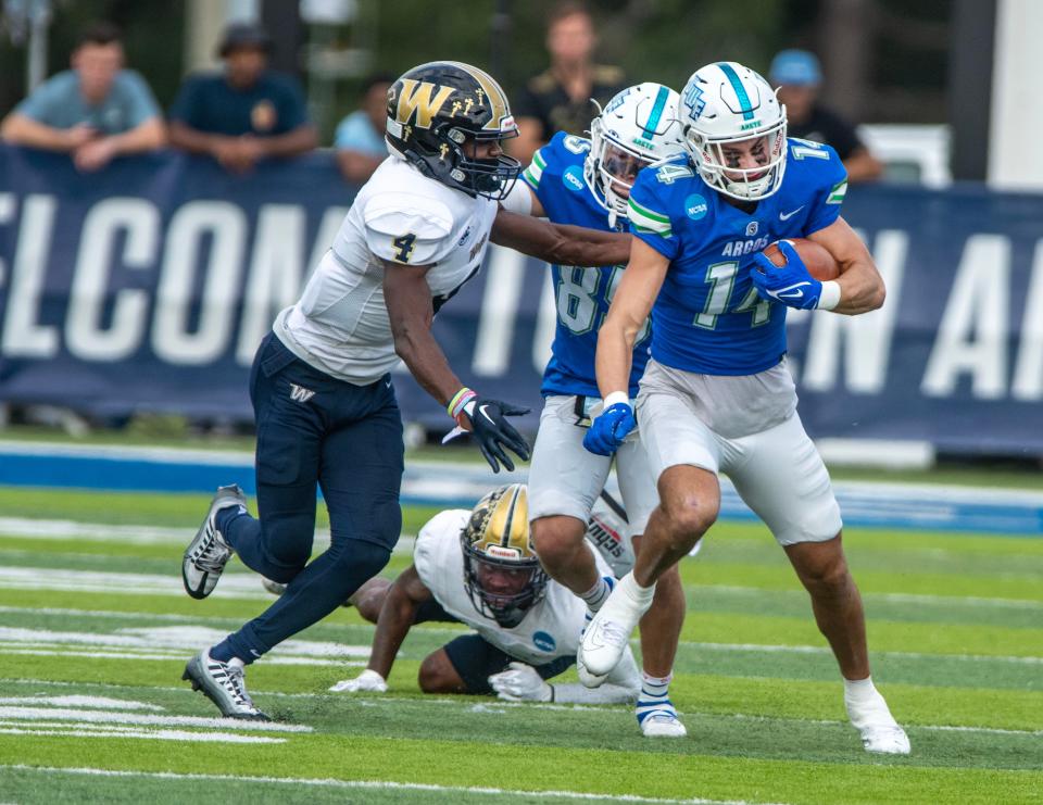 West Florida's Caden Leggett (14) runs down field during the 2022 NCAA Division II Football Championship National Quarterfinal at Pen Air Field at the University of West Florida. West Florida went on the beat Wingate 45-14.