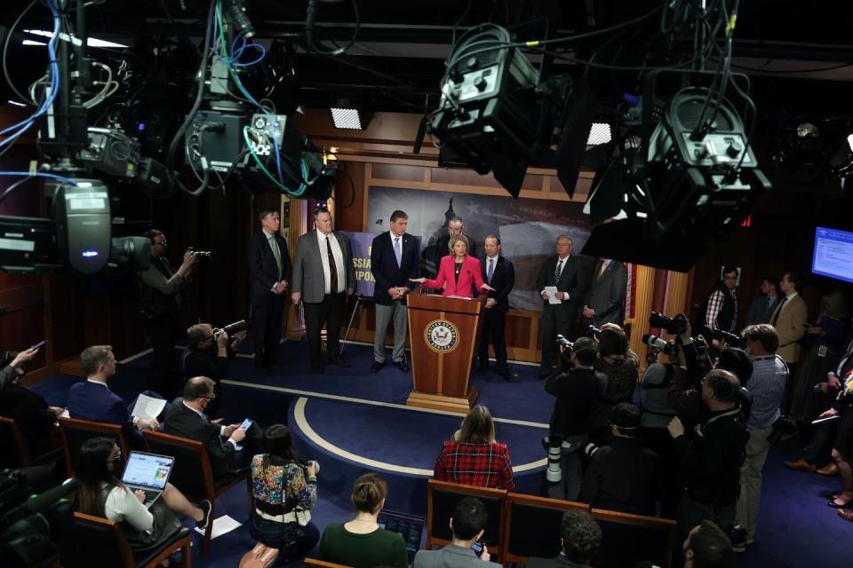 Sen. Lisa Murkowski, a Republican from Alaska, speaks during a news conference at the Capitol on March 3, 2022, in Washington, surrounded by a bipartisan group of Senate and House members. <a href="https://www.gettyimages.com/detail/news-photo/sen-lisa-murkowski-speaks-during-a-news-conference-at-the-u-news-photo/1378130893?phrase=Senators%20discuss%20bipartisan&adppopup=true" rel="nofollow noopener" target="_blank" data-ylk="slk:Alex Wong/Getty Images;elm:context_link;itc:0;sec:content-canvas" class="link ">Alex Wong/Getty Images</a>