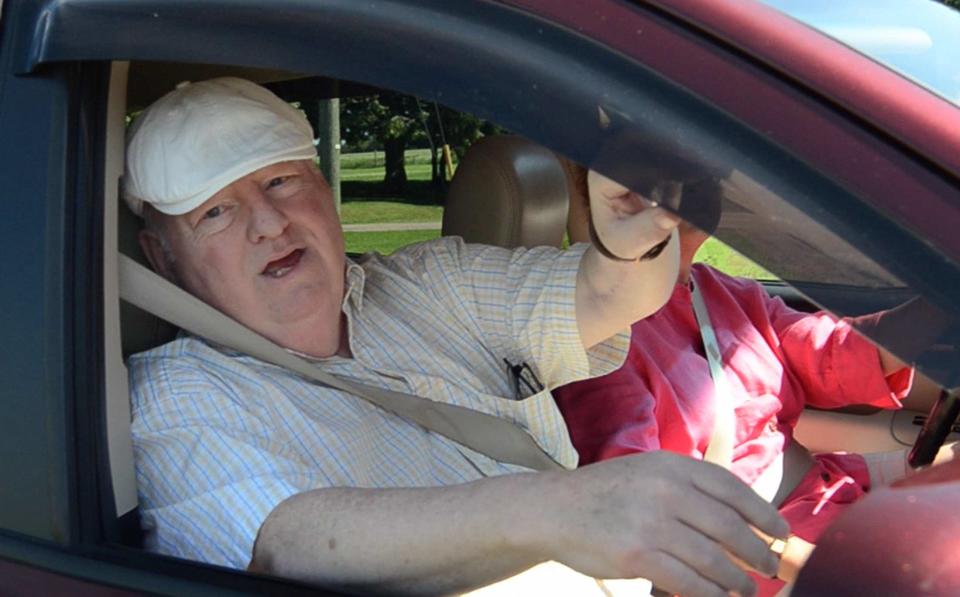 Senator Mike Duffy speaks while in his vehicle outside a pet kennel in Kensington, P.E.I. (Reuters)