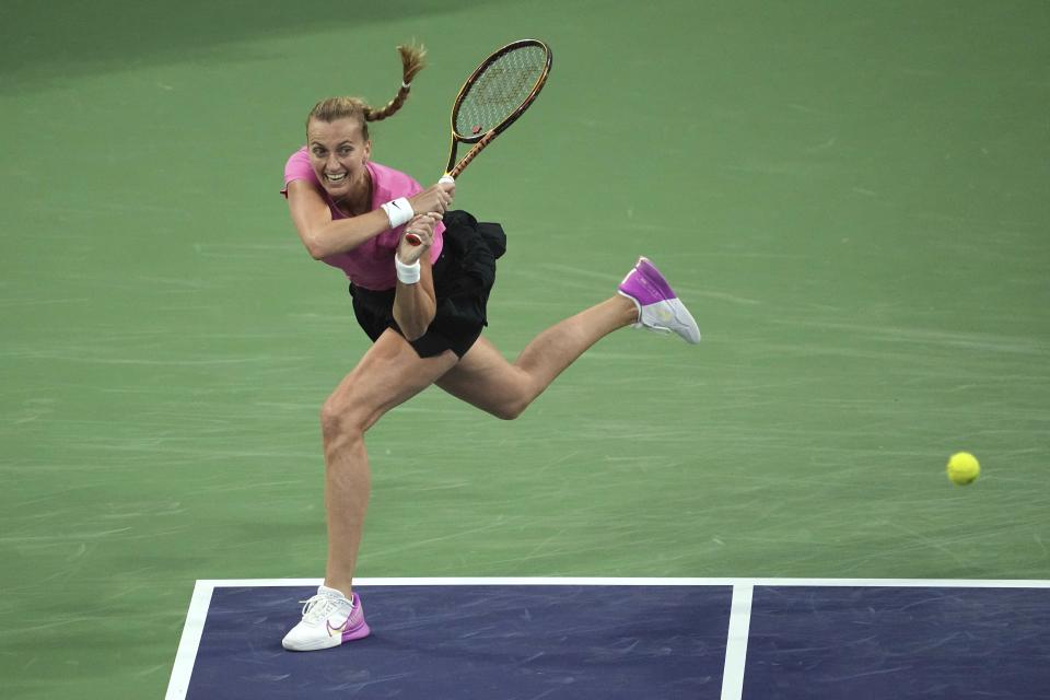 Petra Kvitova, of the Czech Republic, returns a shot to Jelena Ostapenko, of Latvia, at the BNP Paribas Open tennis tournament Sunday, March 12, 2023, in Indian Wells, Calif. (AP Photo/Mark J. Terrill)