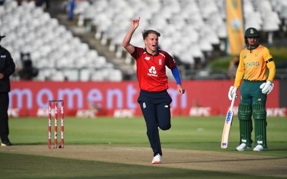 Sam Curran (L) of England celebrates his score during the 1st Twenty20 International between South Africa and England at Newlands Stadium in Cape Town - GETTY IMAGES