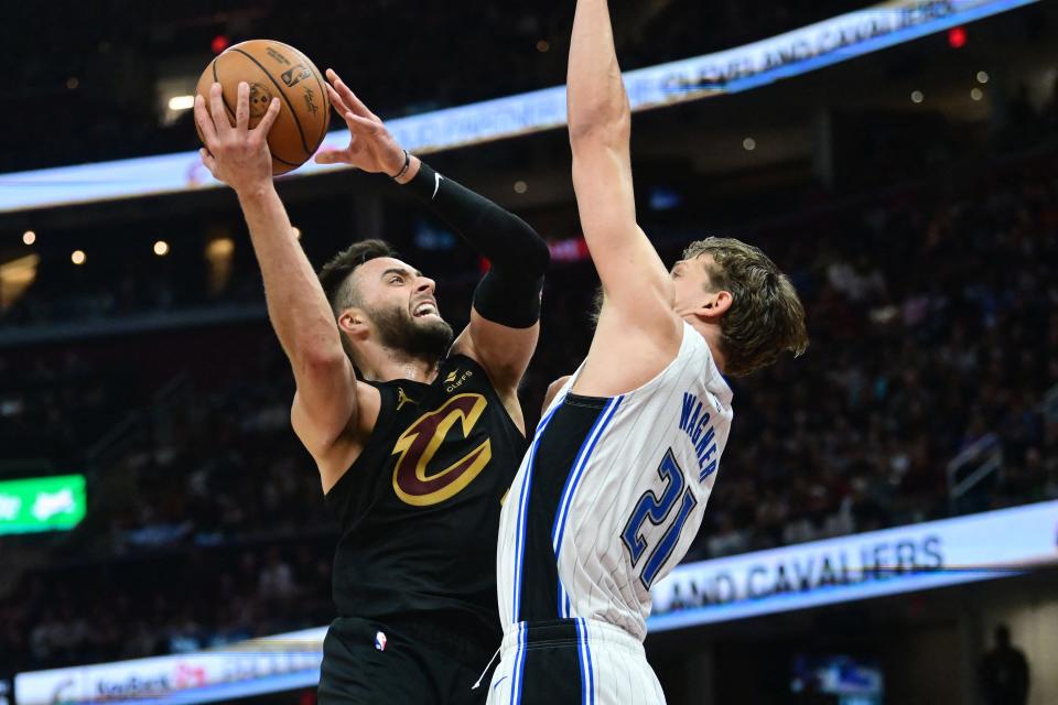 Cavaliers guard Max Strus drives to the basket against Magic center Moritz Wagner during the second half in Game 5 of a first-round NBA playoff series, April 30, 2024, in Cleveland.