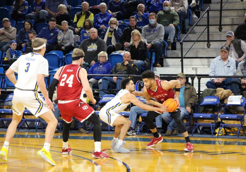 SDSU's Matt Mims defends Denver's Coban Porter during Saturday's Summit League game at Frost Arena.