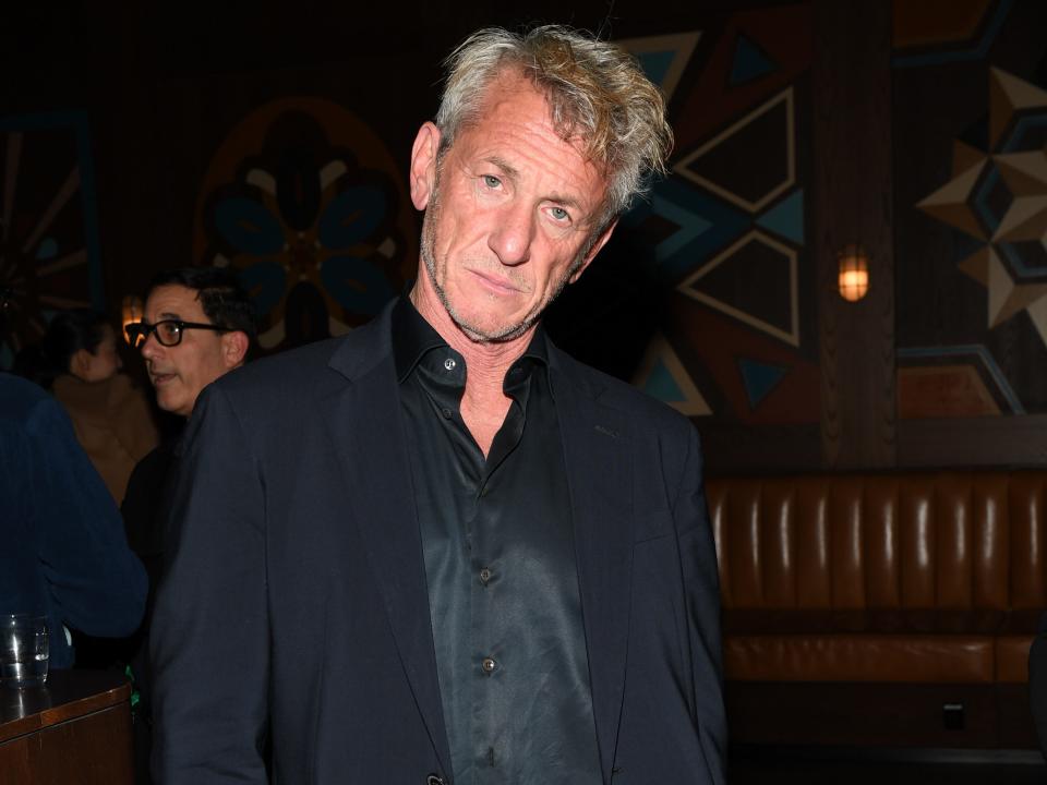 Sean Penn in a dark jacket and shirt