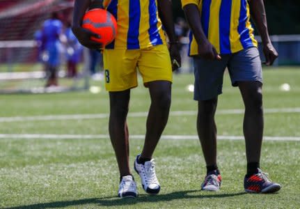 Asylum seekers take part in the soccer tournament