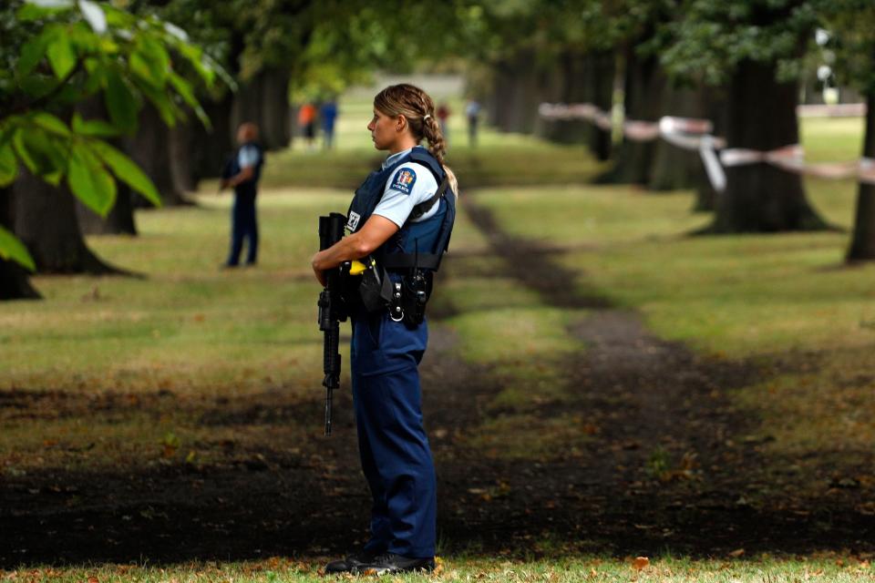 Police officers guard the area close to the Masjid al Noor mosque after a shooting in Christchurch on March 15, 2019.