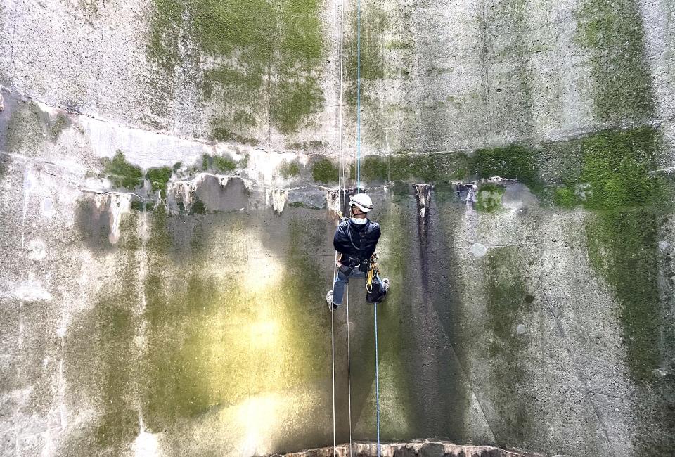 Scott Colburn, a civil engineer with the U.S. Bureau of Reclamation, inspects the interior walls of the Glory Hole spillway at Whiskeytown Dam on Tuesday, Jan. 30, 2023.